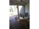 Sunroom with table and chairs, and access to a patio at 7108 Saint Andrews Ln, Sarasota, FL 34243