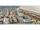 Aerial view of beachfront property, showcasing a multi-story building and ocean at 11605 Gulf Blvd # 505, Treasure Island, FL 33706
