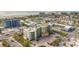 Aerial view of beachfront property, showcasing a multi-story building and ocean at 11605 Gulf Blvd # 505, Treasure Island, FL 33706