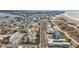 Aerial view of beachfront property, showcasing building and surrounding area at 11605 Gulf Blvd # 505, Treasure Island, FL 33706
