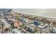 Aerial view of beachfront property, showcasing a multi-story building and ocean at 11605 Gulf Blvd # 505, Treasure Island, FL 33706