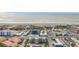 Aerial view of beachfront property, showcasing a multi-story building and ocean at 11605 Gulf Blvd # 505, Treasure Island, FL 33706