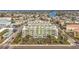 Aerial view of a building near a waterfront area with surrounding buildings at 11605 Gulf Blvd # 505, Treasure Island, FL 33706