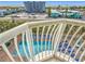 Balcony overlooking the pool and surrounding area at 11605 Gulf Blvd # 505, Treasure Island, FL 33706