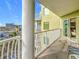 Balcony offering partial ocean view and glimpse of bedroom at 11605 Gulf Blvd # 505, Treasure Island, FL 33706