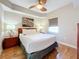 Bright bedroom with a queen bed, nightstands, and wood floors at 11605 Gulf Blvd # 505, Treasure Island, FL 33706