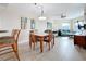 Dining area with glass-top table and four chairs at 11605 Gulf Blvd # 505, Treasure Island, FL 33706