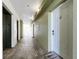 Clean and well-lit hallway with access to unit 505 at 11605 Gulf Blvd # 505, Treasure Island, FL 33706