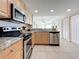 Modern kitchen with granite countertops and stainless steel appliances at 11605 Gulf Blvd # 505, Treasure Island, FL 33706