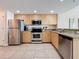 Updated kitchen featuring stainless steel appliances and granite countertops at 11605 Gulf Blvd # 505, Treasure Island, FL 33706