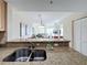 Kitchen with granite countertop and stainless steel sink at 11605 Gulf Blvd # 505, Treasure Island, FL 33706