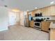 Kitchen with stainless steel appliances and granite countertops at 11605 Gulf Blvd # 505, Treasure Island, FL 33706