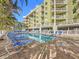 Resort-style pool with multiple lounge chairs for ultimate relaxation at 11605 Gulf Blvd # 505, Treasure Island, FL 33706