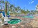 Relaxing pool area with spa and accessible lift at 11605 Gulf Blvd # 505, Treasure Island, FL 33706