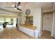 Community room features a kitchenette and a clock at 12200 Vonn Rd # 2109, Largo, FL 33774