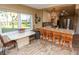 Kitchen with breakfast bar and view to the living room at 12200 Vonn Rd # 2109, Largo, FL 33774