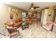 Spacious living room with leather sectional and tiled floors at 12200 Vonn Rd # 2109, Largo, FL 33774