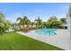 Relaxing kidney-shaped pool with patio furniture at 13151 87Th Pl, Seminole, FL 33776