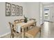 Dining area with wooden table, bench and cross-back chairs at 1508 Hammer Pl, Largo, FL 33774