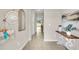 Bright and airy entryway with tile flooring and a console table at 1508 Hammer Pl, Largo, FL 33774