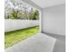 Private backyard patio with a view of the green lawn at 1508 Hammer Pl, Largo, FL 33774