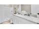 Clean bathroom with double vanity, large mirror, and a shower/tub combo at 1524 Hammer Pl, Largo, FL 33774
