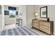 Cozy bedroom with dresser and a large window with a view at 1532 Hammer Pl, Largo, FL 33774