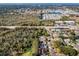 Aerial view of homes near the coast, featuring waterways and residential areas at 1597 Franklin Way, Dunedin, FL 34698