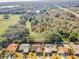 Aerial view of houses and surrounding landscape at 1597 Franklin Way, Dunedin, FL 34698