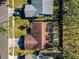 Aerial view showing house, yard, and driveway at 1597 Franklin Way, Dunedin, FL 34698