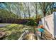 Large backyard with a bird bath and wooden fence at 1597 Franklin Way, Dunedin, FL 34698