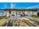 Peaceful backyard patio with brick pavers and a small table with chairs at 1597 Franklin Way, Dunedin, FL 34698