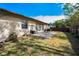 Spacious backyard with patio and wooden fence at 1597 Franklin Way, Dunedin, FL 34698
