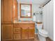 Updated bathroom with wood vanity and shower/tub combo at 1597 Franklin Way, Dunedin, FL 34698