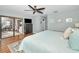 Main bedroom with king bed and sliding doors to patio at 1597 Franklin Way, Dunedin, FL 34698