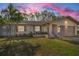 Charming single-story home with landscaped yard and attached garage at 1597 Franklin Way, Dunedin, FL 34698