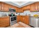 Updated kitchen with wood cabinets and granite at 1597 Franklin Way, Dunedin, FL 34698