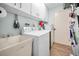 Laundry room with washer, dryer, and extra storage at 1597 Franklin Way, Dunedin, FL 34698
