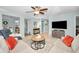 Living room with sectional sofa, coffee table, and views into other rooms at 1597 Franklin Way, Dunedin, FL 34698