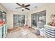 Bright sunroom perfect for ' play area with access to backyard at 1597 Franklin Way, Dunedin, FL 34698