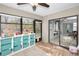 Sunroom with toy storage and view of the backyard at 1597 Franklin Way, Dunedin, FL 34698