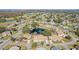 Aerial view showing community, landscape and a central pond at 2243 Greenwich Dr, Sun City Center, FL 33573