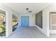 Covered back patio with access to backyard and screened porch at 2243 Greenwich Dr, Sun City Center, FL 33573