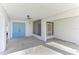 Covered back patio with light blue doors leading inside at 2243 Greenwich Dr, Sun City Center, FL 33573