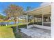 Backyard with screened porch and peaceful lake view at 2243 Greenwich Dr, Sun City Center, FL 33573