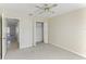Well-lit bedroom, with access to the hallway and bathroom at 2243 Greenwich Dr, Sun City Center, FL 33573