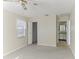 Bright bedroom with ceiling fan and access to bathroom at 2243 Greenwich Dr, Sun City Center, FL 33573