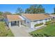 Single story home with a carport and well-manicured lawn at 2243 Greenwich Dr, Sun City Center, FL 33573