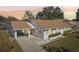 Single story home with carport and pond view at 2243 Greenwich Dr, Sun City Center, FL 33573