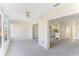 Living room with view into the kitchen and sunroom at 2243 Greenwich Dr, Sun City Center, FL 33573